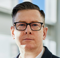 Alexander Hughes CEO retrato executivo de empresa de trading de criptomoedas